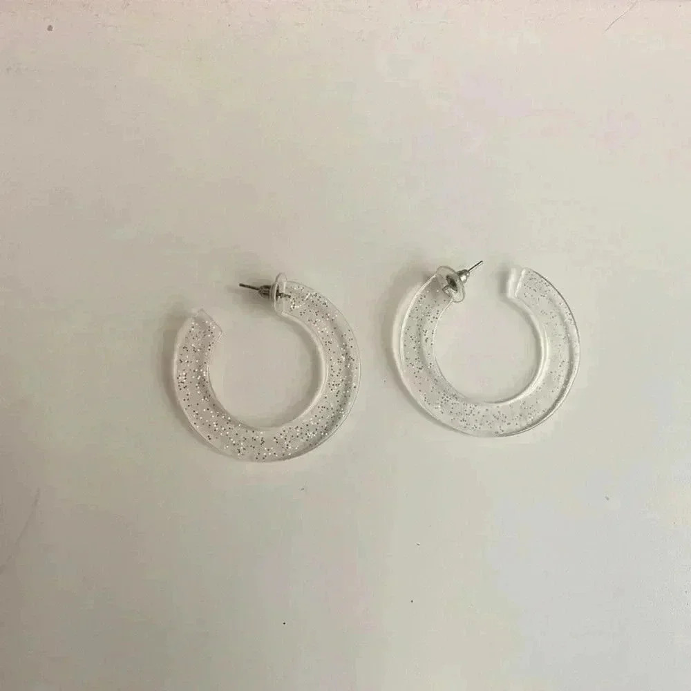 Clear sparkly chunky hoop earrings.